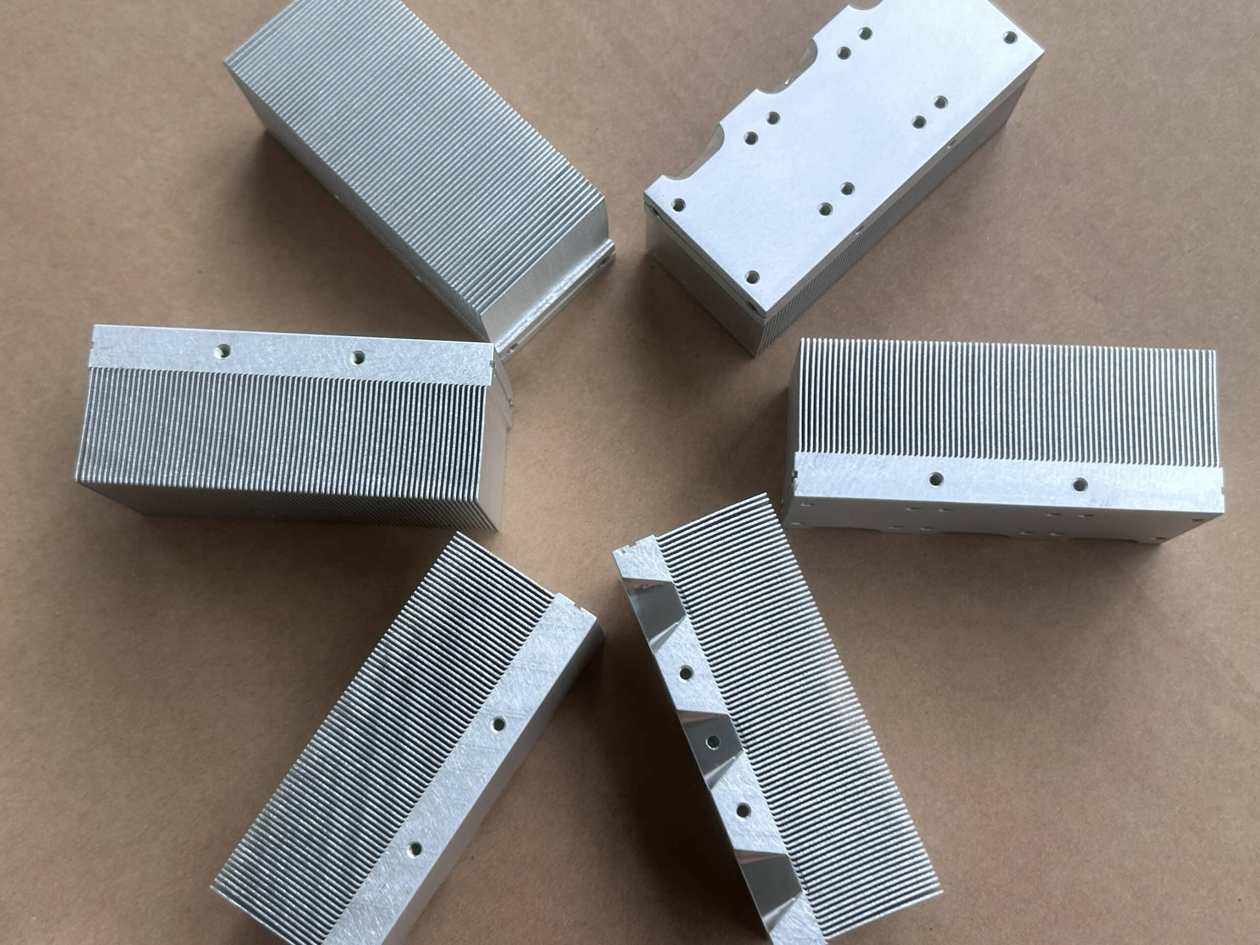 Several Skived Fin Heat Sinks are positioned in a circle