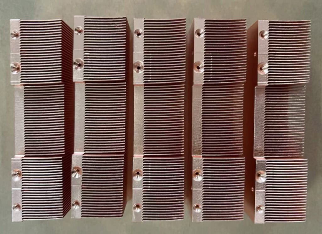 Copper heat sinks for localized heat spreading in telecom electronics