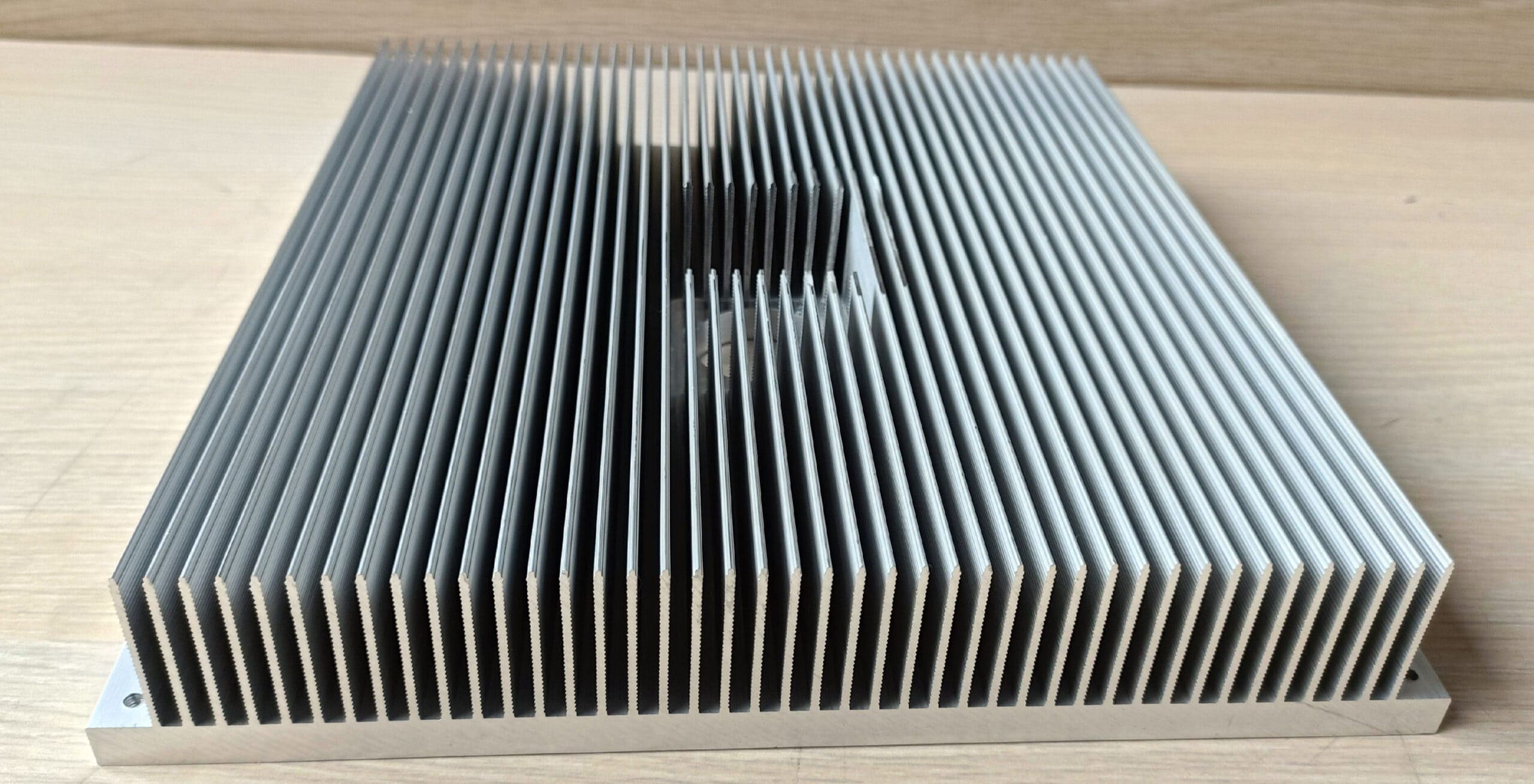 Custom extruded aluminum heat sink with high-density fins