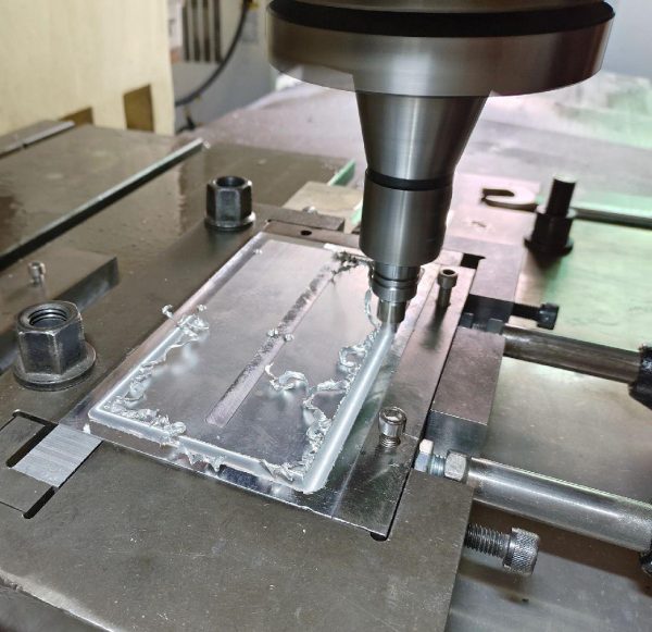 Aluminum liquid cold plate undergoing precision machining